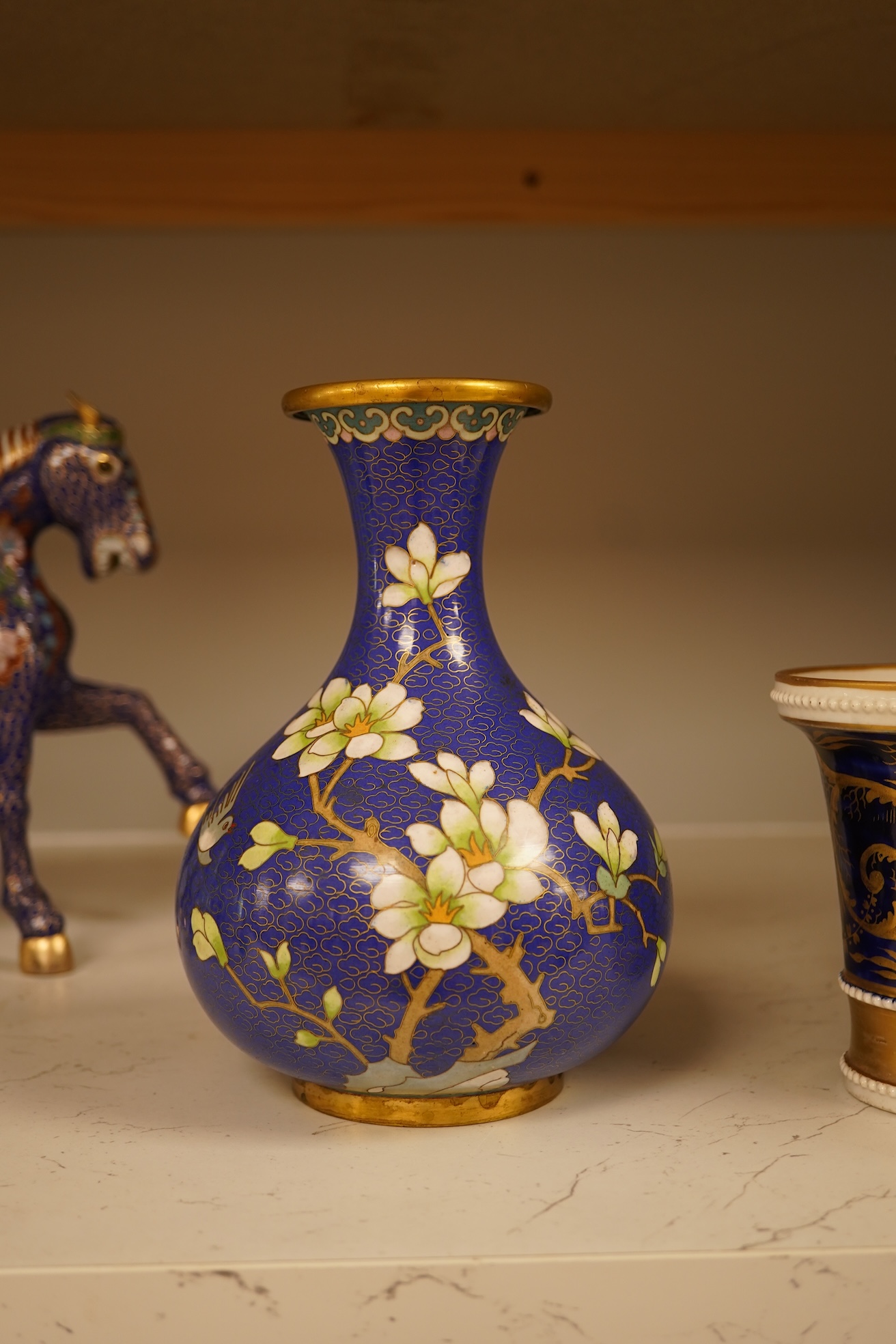 A Chinese cloisonné enamel horse and vase, two miniature Rockingham floral teapots, a malachite box etc (9). Cloisonné horse 20cm long.
